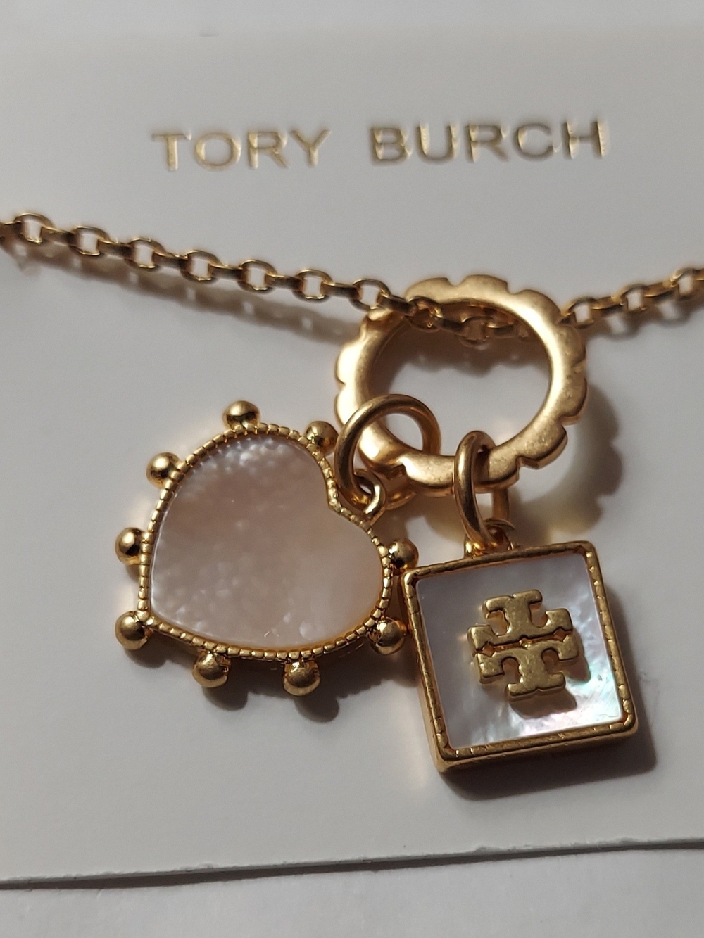 Tory Burch Gold Necklace with White Mother-of-Pearl Heart & Logo Charms